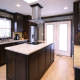 flat surface cooktop,stainless hood,contemporary kitchen,custom cabinets