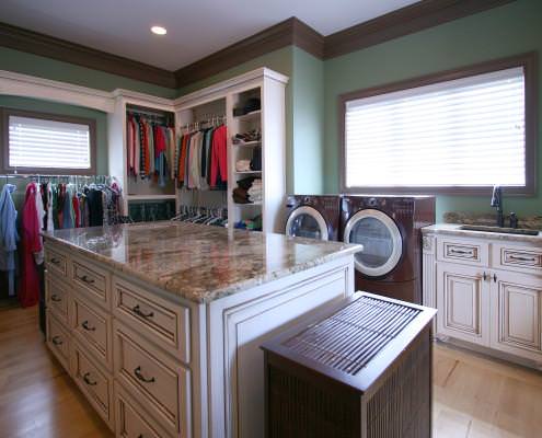 laundry room,custom closet,washer and dryer,folding area