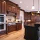 kitchen,island,paneled appliance,display,pot filler,tile back-splash