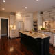 French Country style,kitchen,island,decorative details,paneled appliance,two toned cabinets