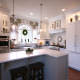 eat in kitchen,custom hood,display shelf,paneled appliances,white kitchen