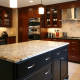 modern cabinetry,stainless hood,glass doors,contemporary design,warming drawer,island