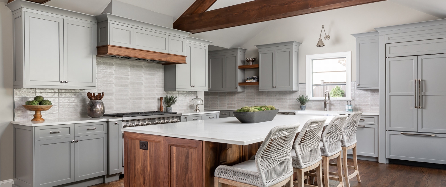 https://walkerwoodworking.com/wp-content/uploads/2020/08/Walker-Woodworking-custom-cabinets-Joe-Pruvis-Loftus-Design-exposed-beam-custom-gray-kitchen-cabinets-panelled-appliances-two-toned-kitchen-1500x630.jpg
