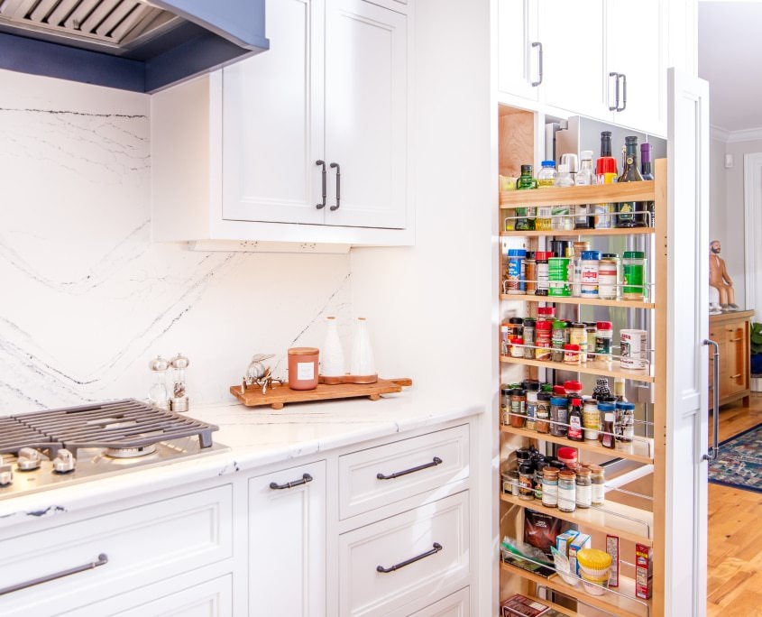 https://walkerwoodworking.com/wp-content/uploads/2022/05/Walker-Woodworking-custom-cabinets-spice-pull-out-pantry-pull-out-inset-cabinets-white-kitchen-cabinets-spice-rack-845x684.jpg