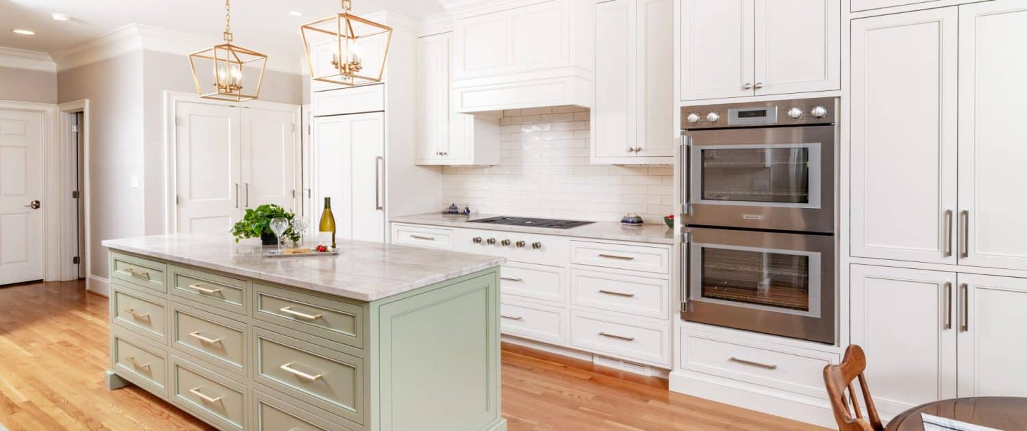 https://walkerwoodworking.com/wp-content/uploads/2023/07/Walker-Woodworking-custom-cabinets-green-kitchen-island-kitchen-lighting-wall-oven-panel-appliance-kitchen-island-drawer-1500x630.jpg