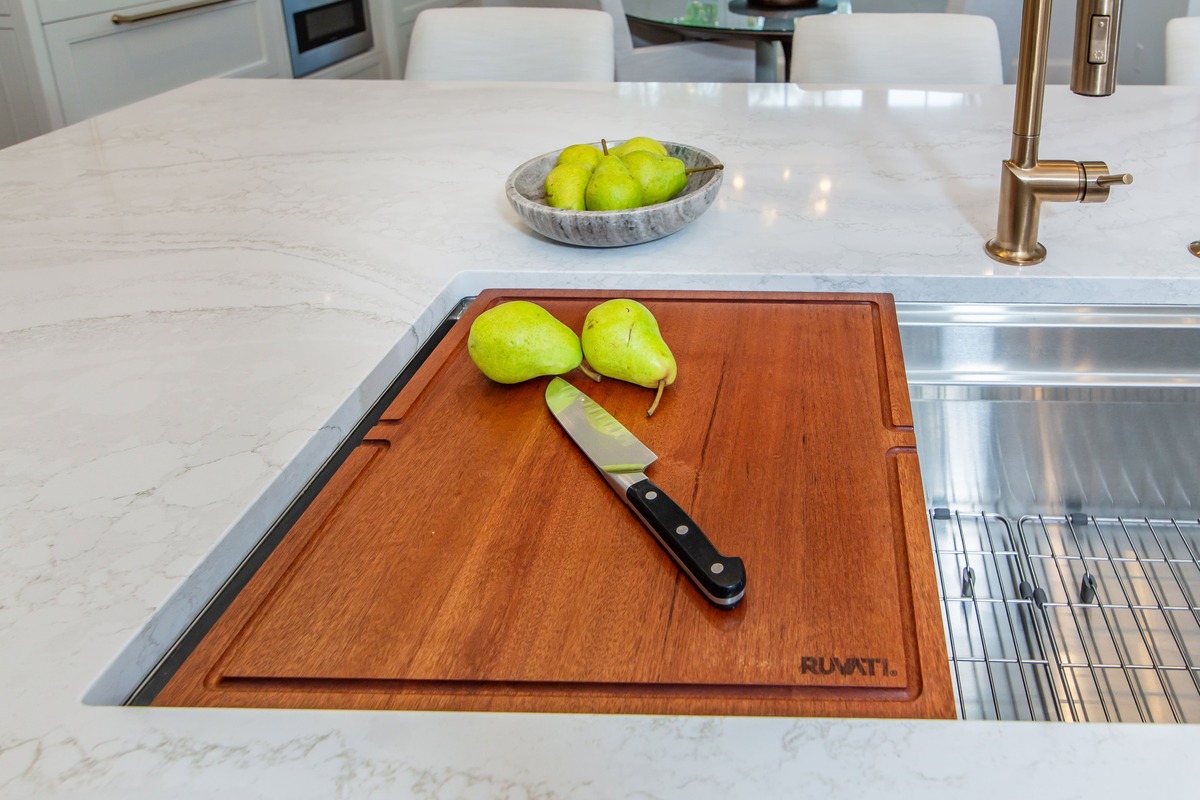 Cutting board in a sink with a knife