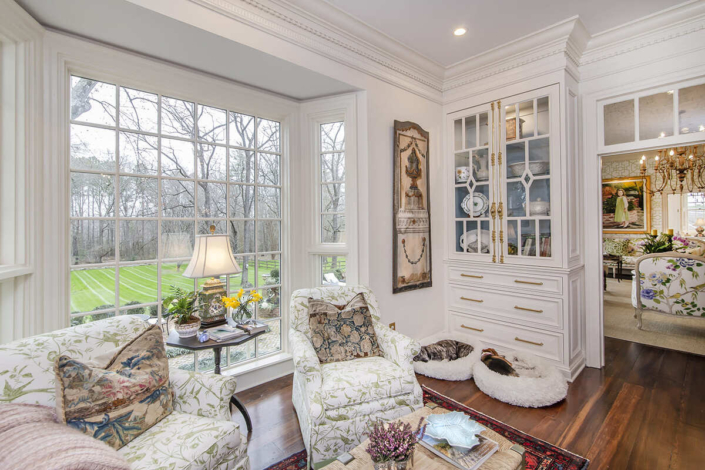 Large white hutch and sitting area with dogs