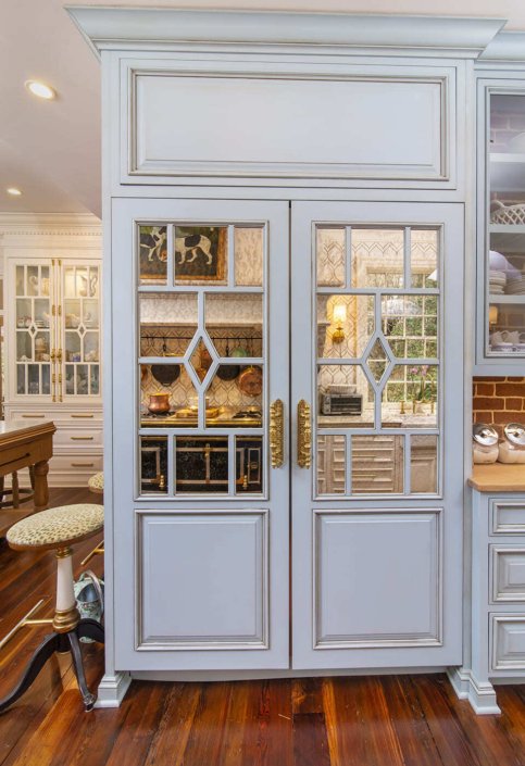 Appliance panel with mirror accents and brass hardware