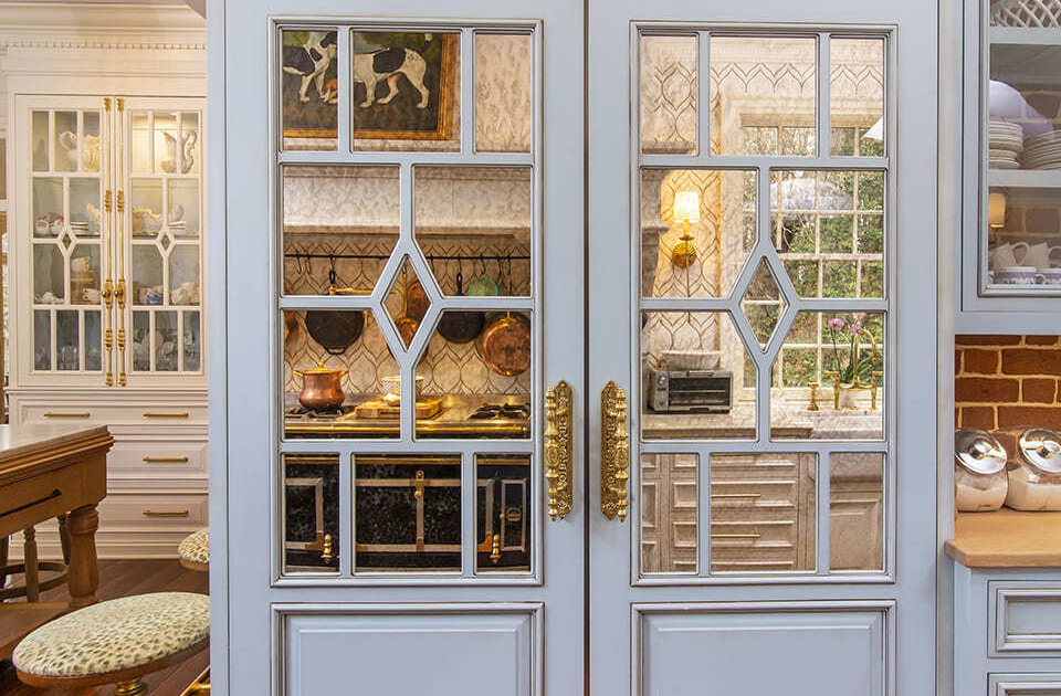 Appliance panel with mirror accents and brass hardware