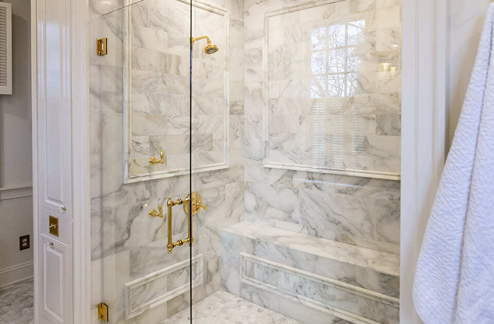 Large walk in shower with tile walls and flooring