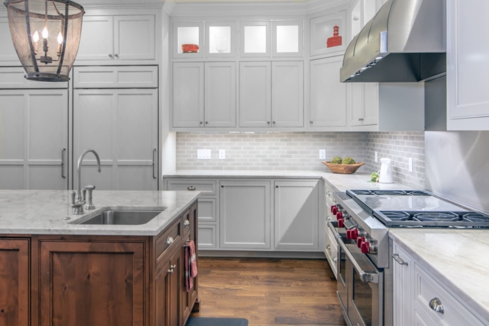 white kitchen with a brown hood