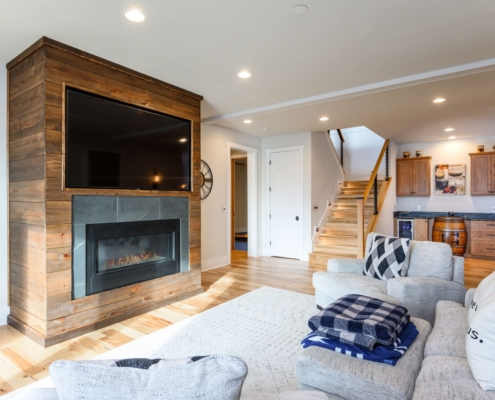 entertainment center with a fireplace and living room