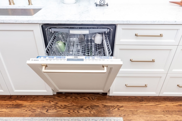 paneled dishwasher with gold hardware