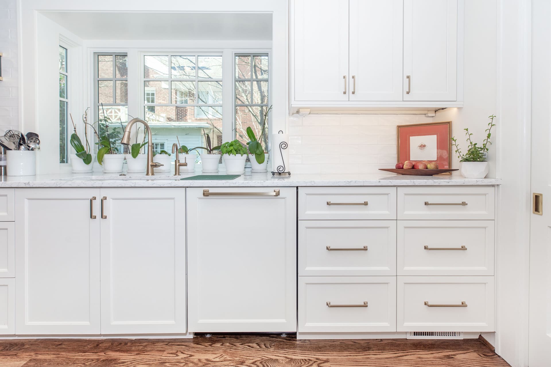 white kitchen with a large window