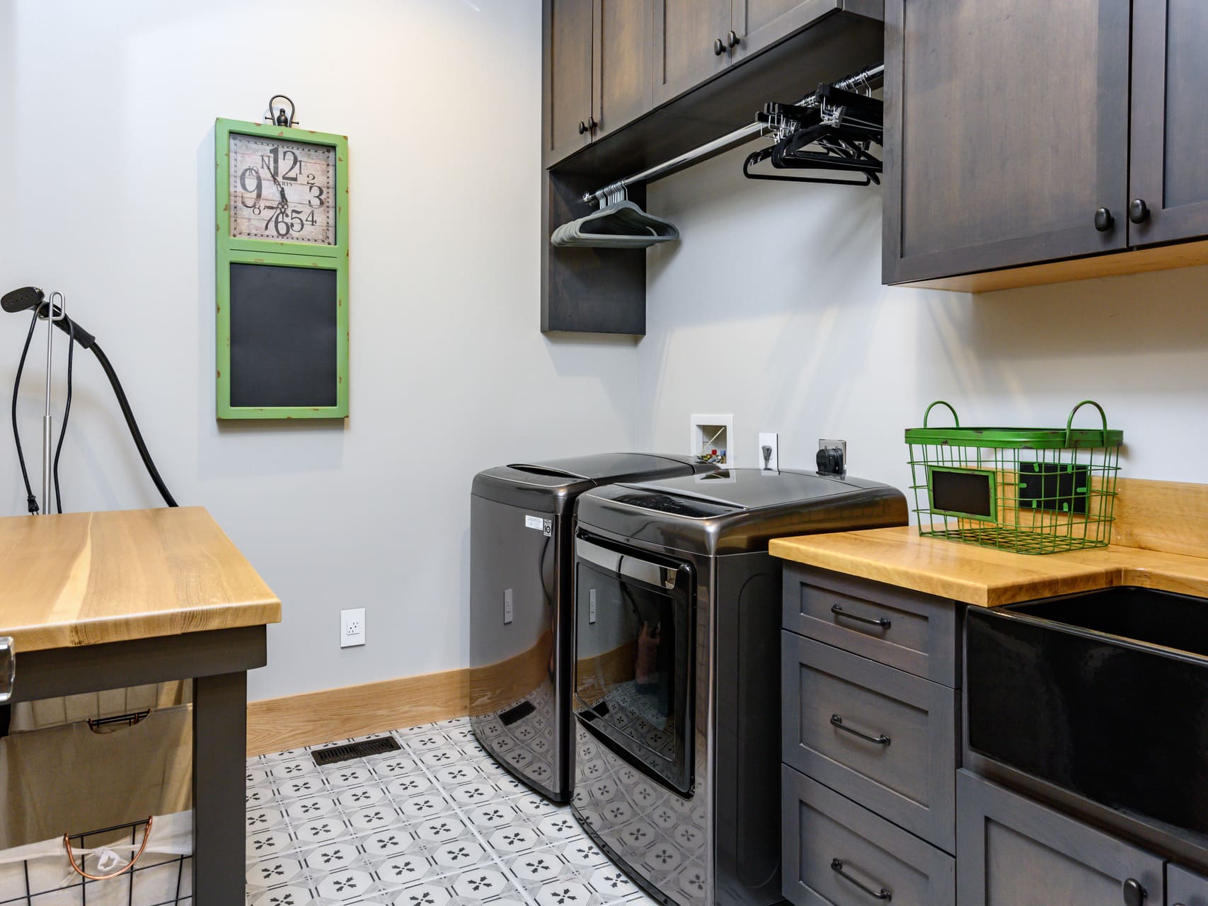 laundry room with hanging storage and a sink