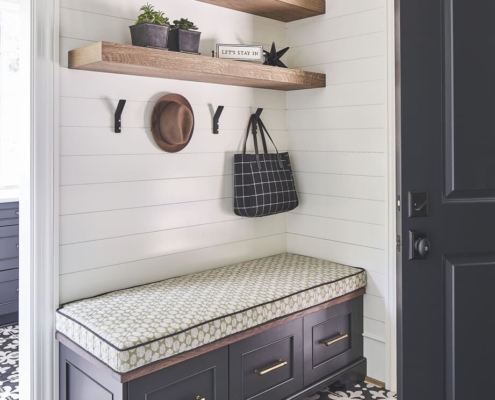 black bench in an entryway