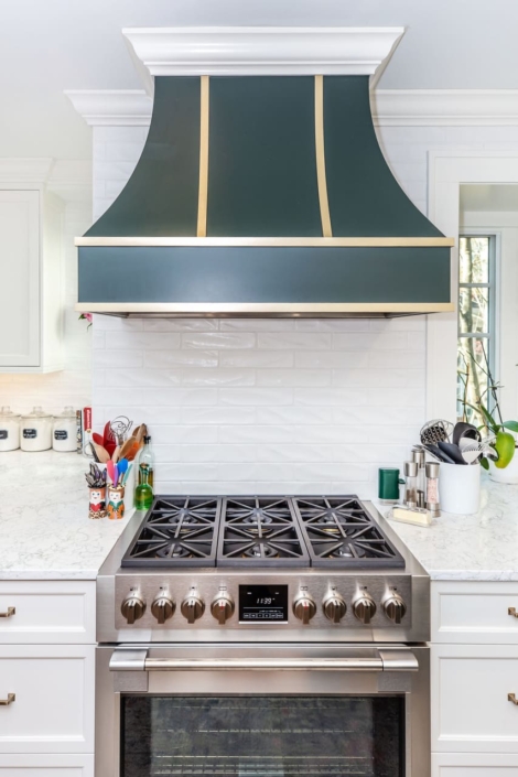 blue hood and tile backsplash