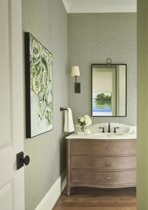 green bathroom with wall decor