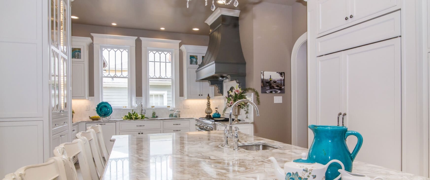 kitchen with a chandelier and panel appliances