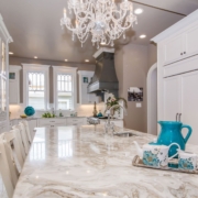 kitchen with a chandelier and panel appliances