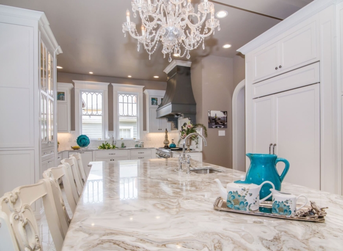 kitchen with a chandelier and panel appliances