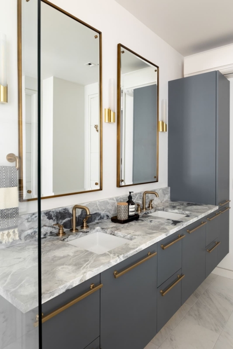 blue bathroom vanity with gold accents