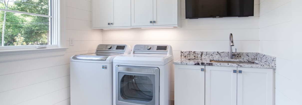 laundry room with a television