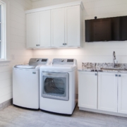 laundry room with a television