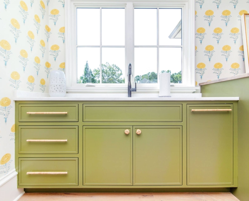 green laundry room with flower wallpaper