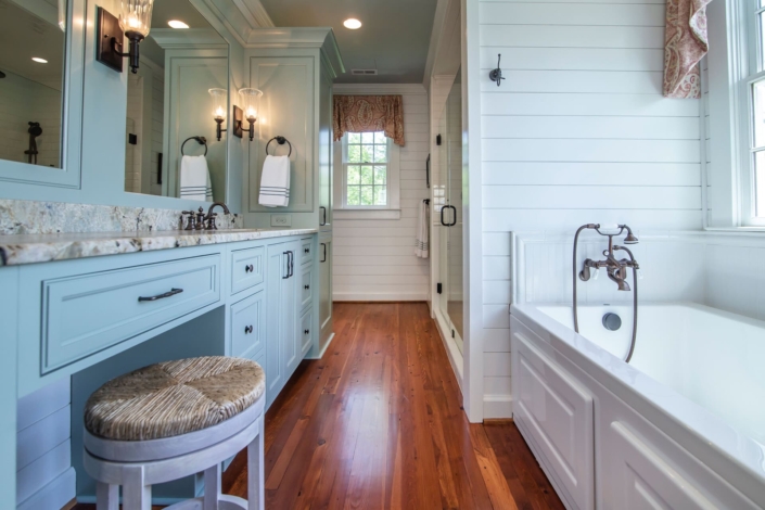 bathroom with a blue vanity