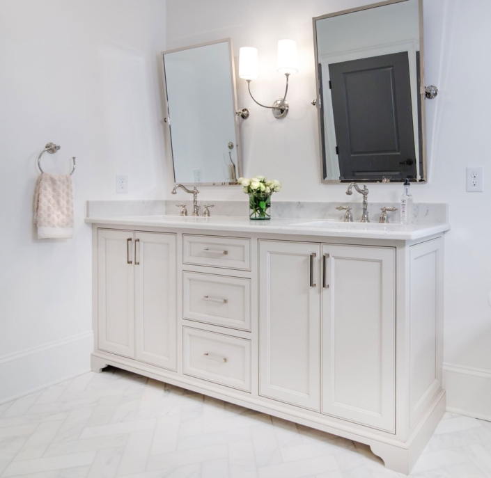 bathroom vanity with tilted mirrors