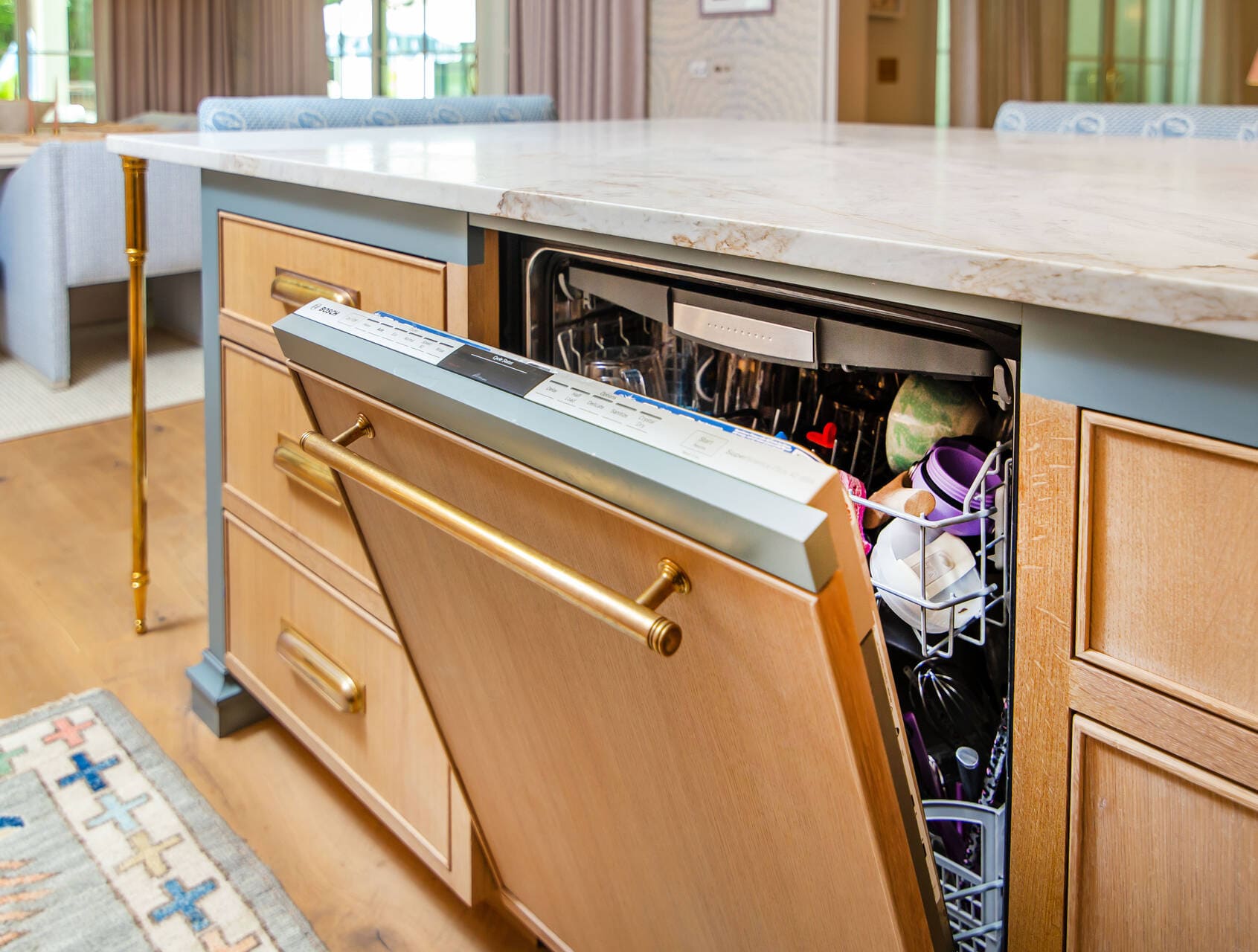 paneled appliance dishwasher with gold hardware