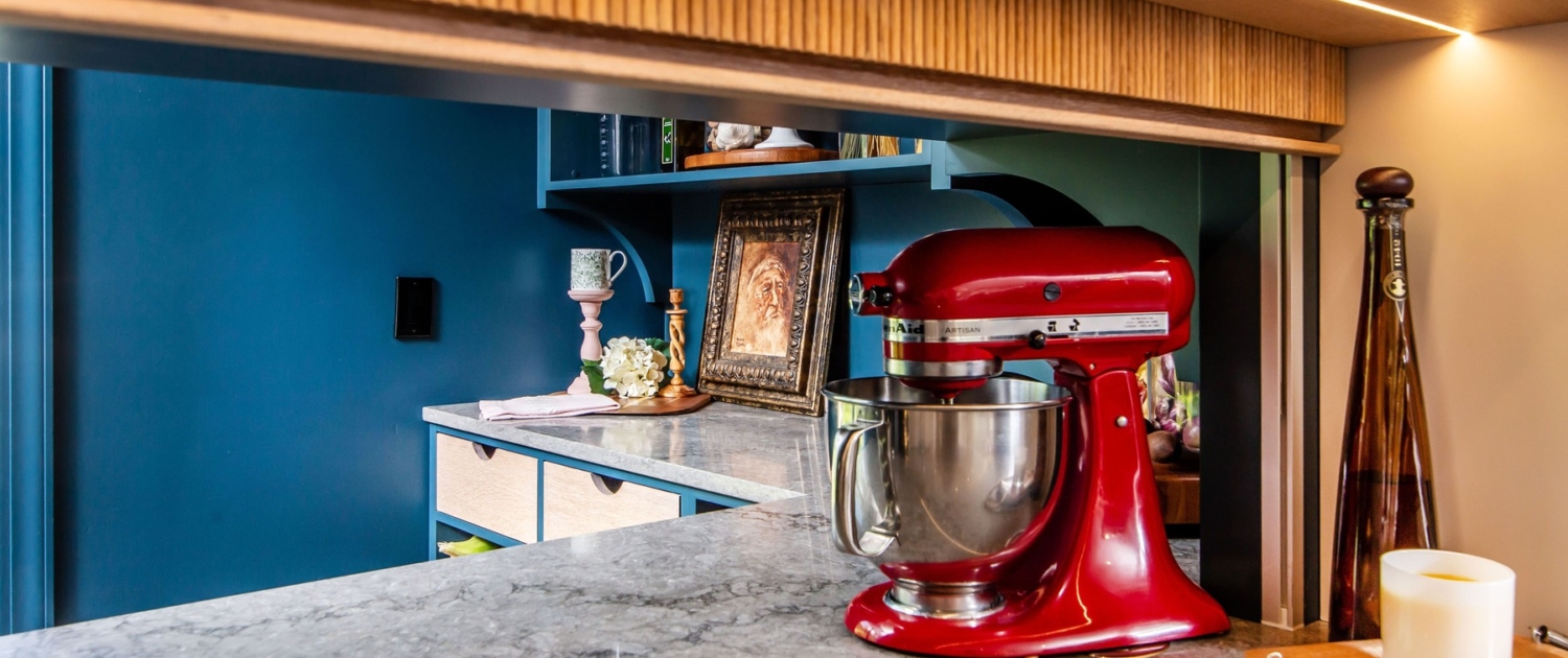 Mixer storage in a pantry with a sliding door