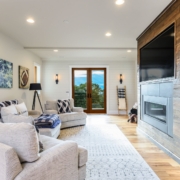 living room with a large entertainment center and glass doors