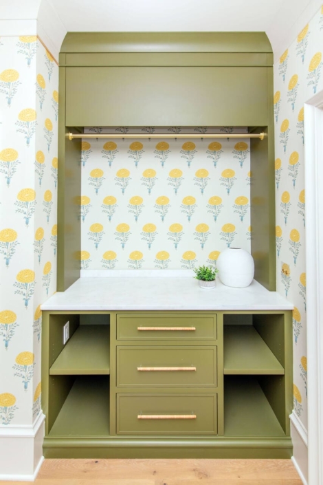 laundry room hanging storage with flower wallpaper