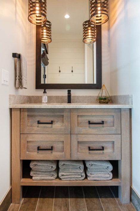 bathroom vanity with gold lights