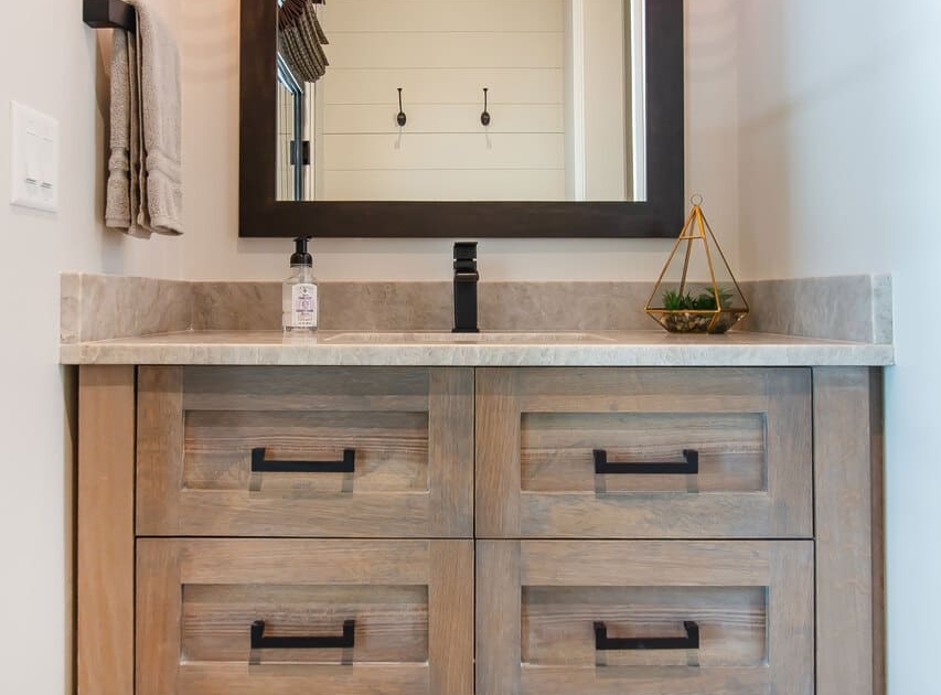 bathroom vanity with gold lights