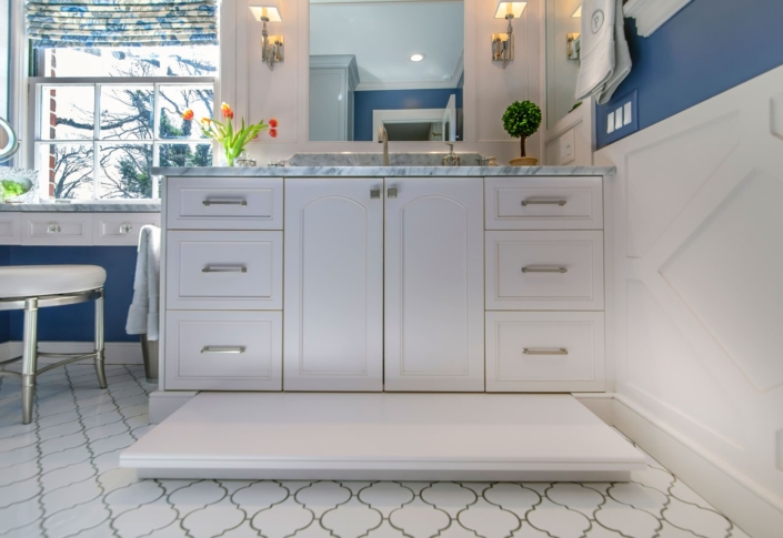 white bathroom vanity with a pullout