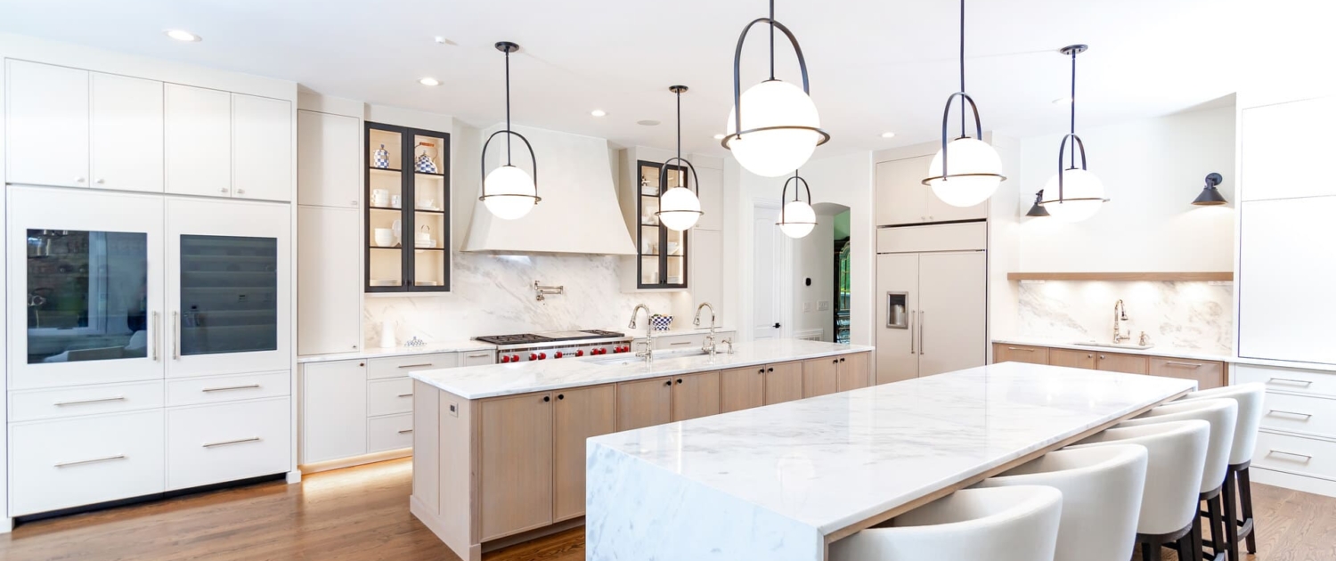 kitchen with big lights and paneled appliances