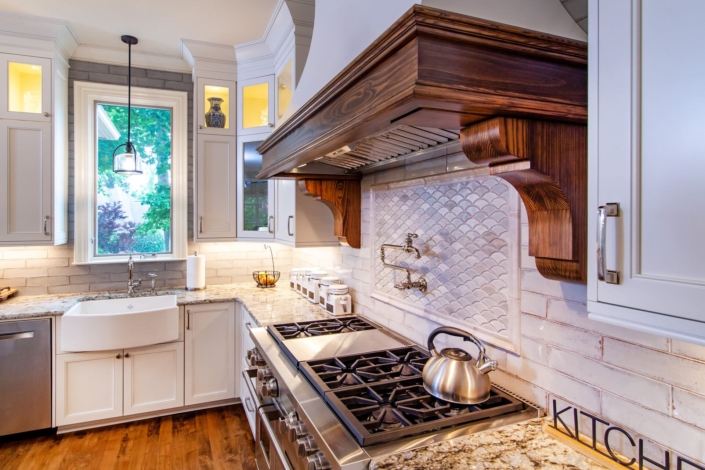 walnut kitchen hood with tile backsplash
