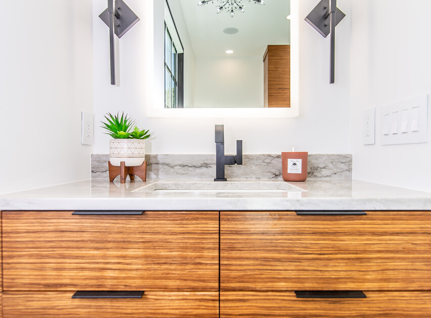 A master bathroom with a close up of a cabinet vanity