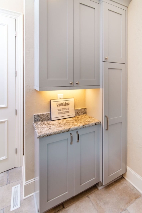 blue laundry room with lighting