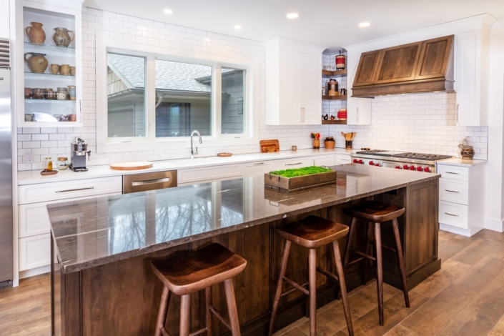 brown hood and island in white kitchen