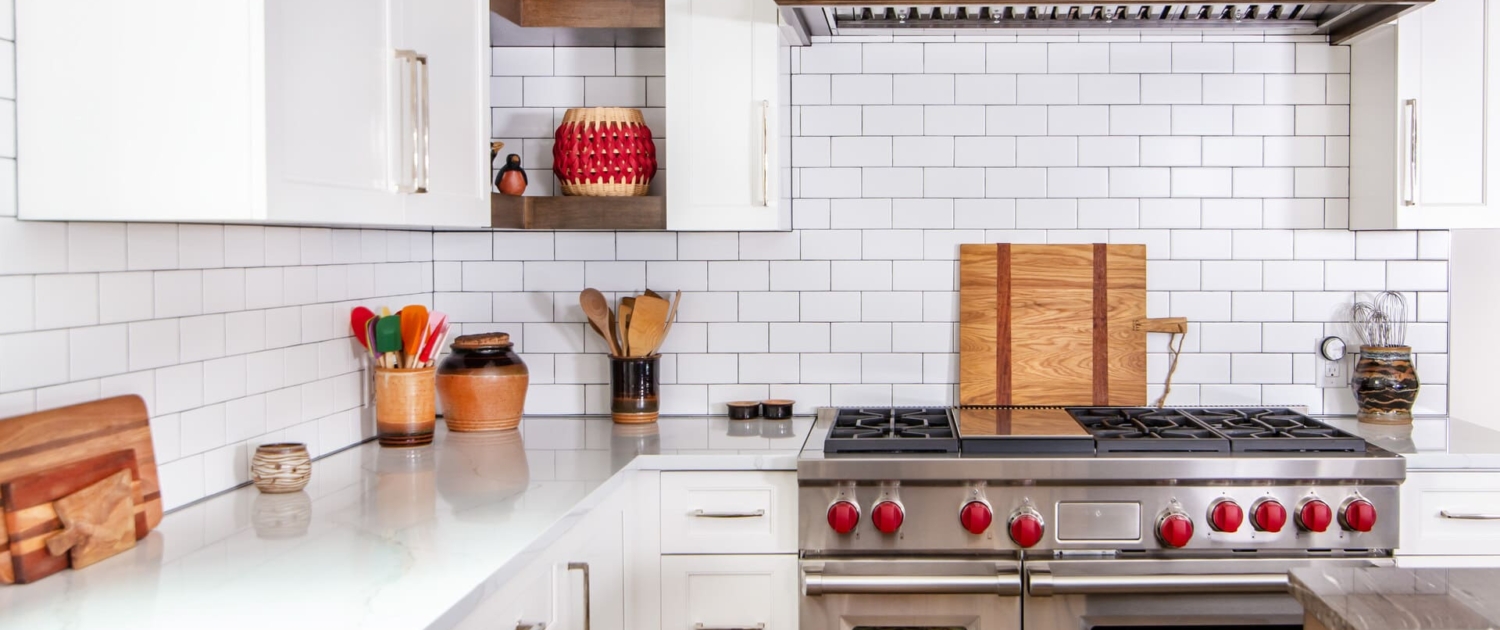 white kitchen with hidden shelves