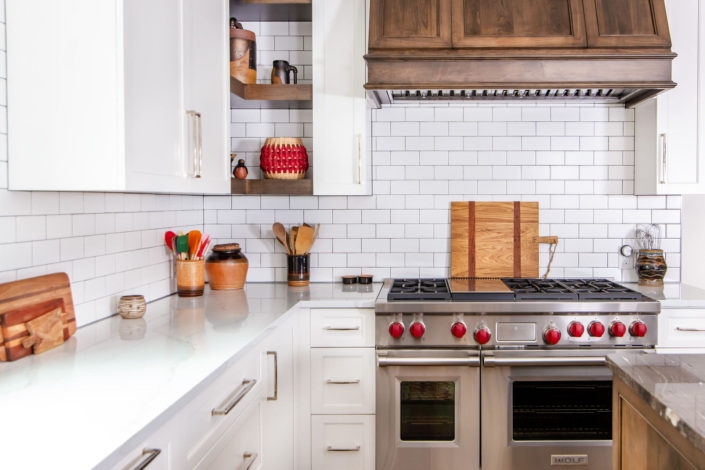 white kitchen with hidden shelves