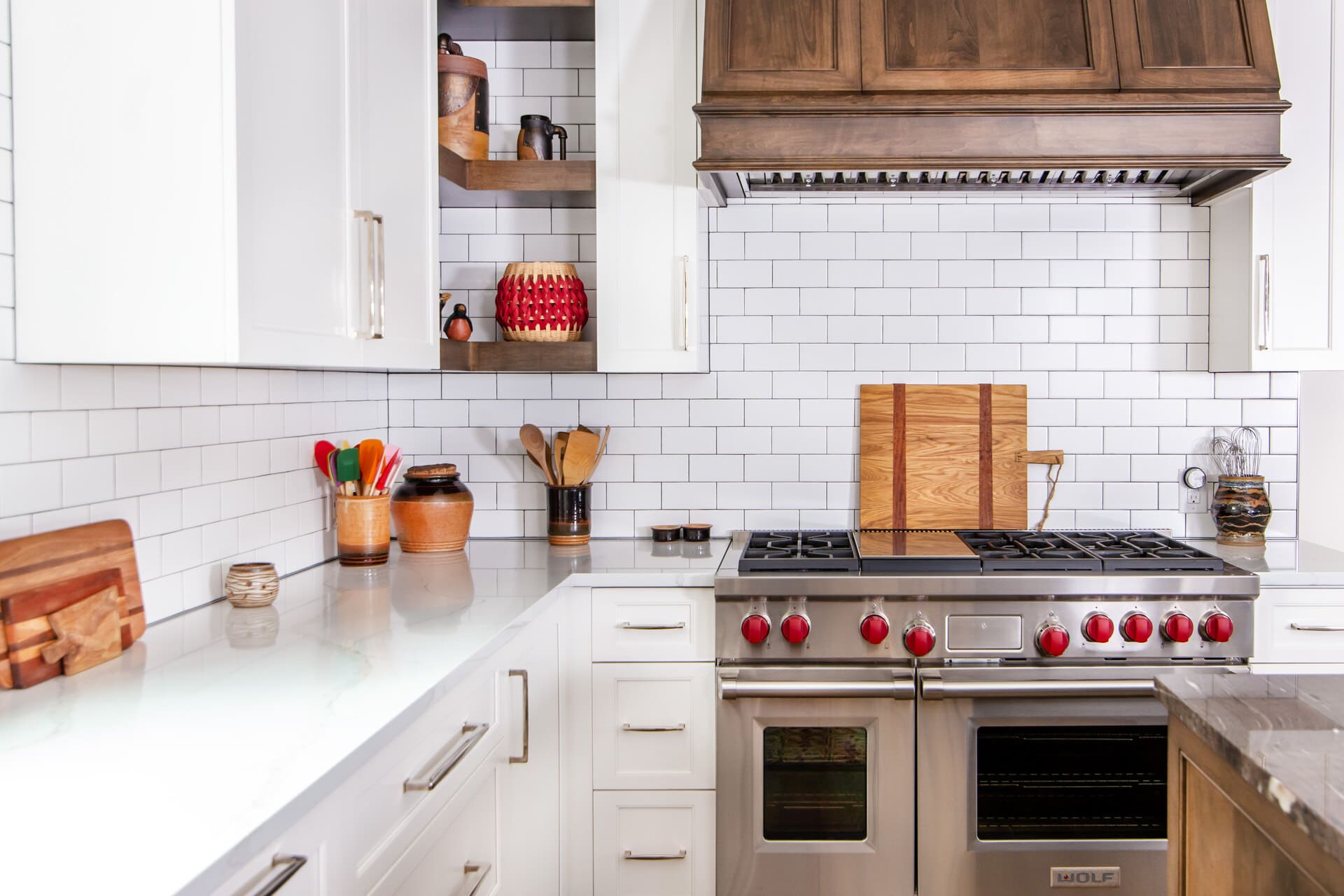 white kitchen with hidden shelves