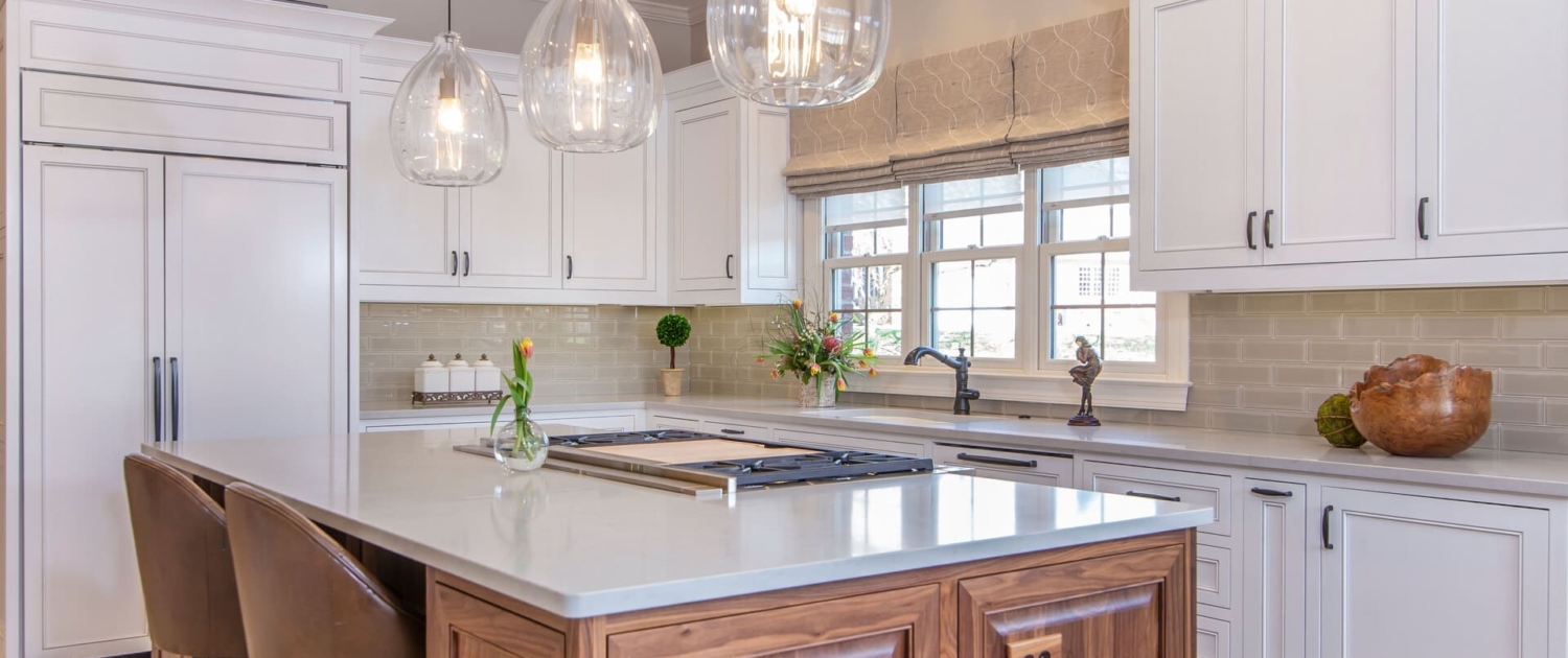 white and brown kitchen with big windows and flowers