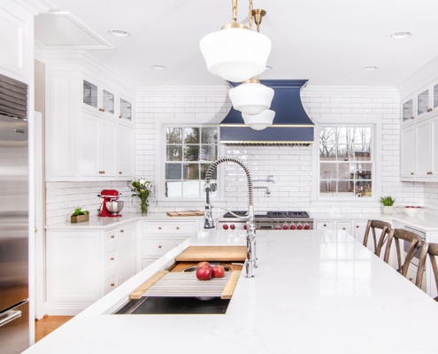 White kitchen cabinets with a island sink
