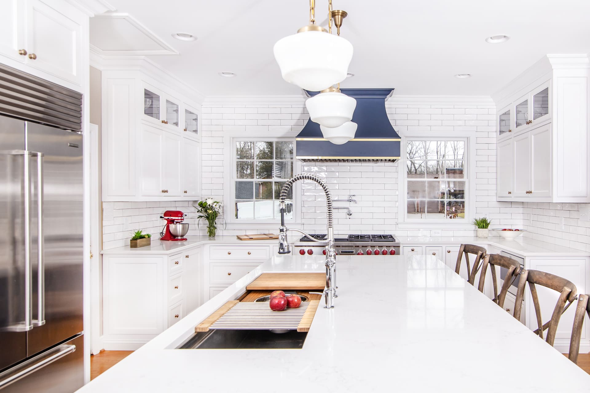 White kitchen cabinets with a island sink