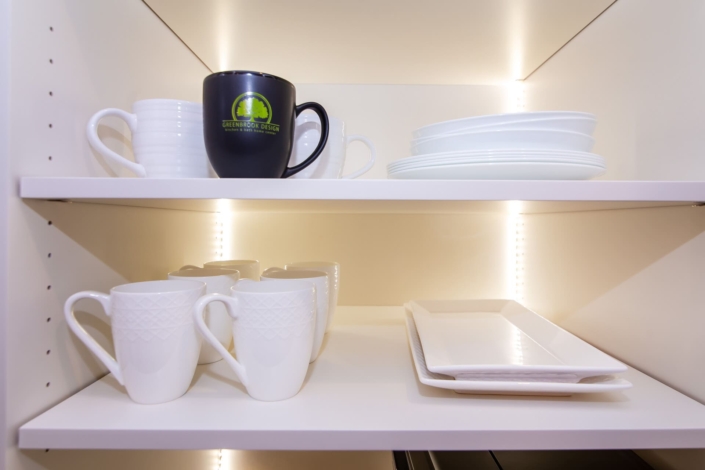 shelves with dishware and lights